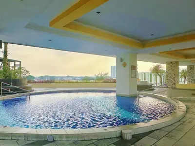 a large swimming pool in the middle of a building at The Majestic Ipoh Town by 178homestay in Ipoh