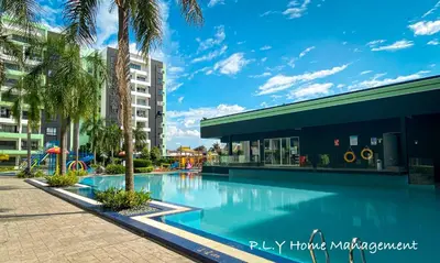 a swimming pool at a resort with a playground at PoolView Waterpark 300Mbps Ipoh Homestay Manhattan Condo 4-7pax 3bedroom Station 18 pengkalan in Ipoh