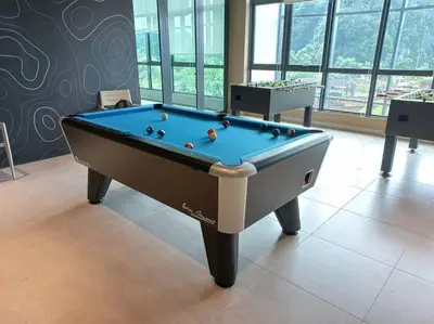 a pool table in the middle of a room at Sunway Onsen Studio @ Lost World of Tambun in Ipoh