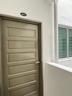 a garage door in a building with a window at Cozystay @ The Quintet, Cameron in Tanah Rata