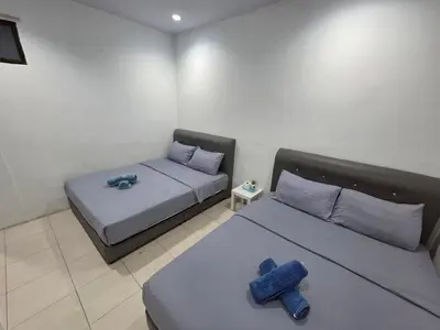 a room with two beds in a room at 184 GURNEY DRIVE PENANG in George Town