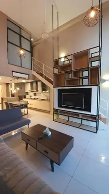 a living room with a couch and a coffee table at Sunrise Gurney By IZ in George Town