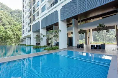 an image of a swimming pool in a building at Ipoh Tambun Lost World Sunway Onsen Suites Luna 2R2B 8paxs in Ipoh