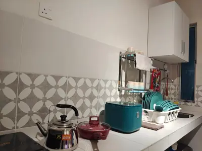 a kitchen counter with a tea pot and other appliances at Pavilionvillie M1T571 by irainbow in Ipoh