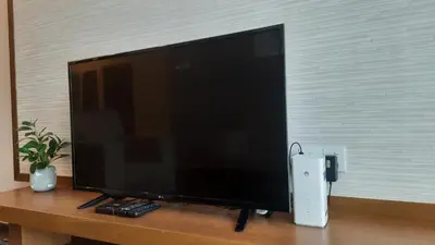 a flat screen tv sitting on top of a table at G Residence - 3R2B The Retreat, Aranda Nova, Cameron Highlands in Cameron Highlands