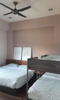 a bedroom with two beds and a ceiling fan at G Residence - 3R2B The Retreat, Aranda Nova, Cameron Highlands in Cameron Highlands
