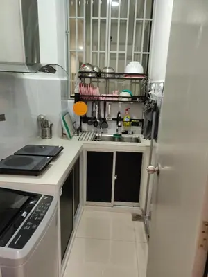 a kitchen with a white refrigerator and a sink at Mars Homestay in Kea Farm Brinchang in Brinchang