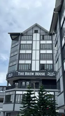 a large building with a sign that reads the brew house at Only You Boutique Hotel Centrum Cameron Highlands in Brinchang