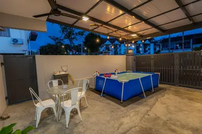 a patio with a ping pong table and chairs at GEORGETOWN 18Px 5R4B V KTV & JACCUZI SPA & POOL TABLE NEAR USM & LAM WAH EE HOSPITAL & HAN CHIANG HIGH SCHOOL - kids pool no more in Gelugor