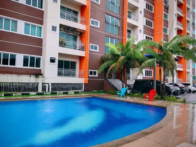a swimming pool in front of a apartment building at Pavilionvillie M1T6100 by irainbow in Ipoh