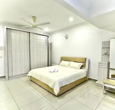 a bedroom with a bed and a large window at Ipoh Deluxe Family Home in Ipoh