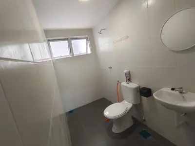 a bathroom with a toilet and a sink at Pavilionvillie M1T11 by irainbow in Simpang Pulai