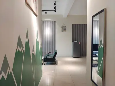an office hallway with a chair and a wall with graphs at Pavilionvillie M1T11 by irainbow in Simpang Pulai