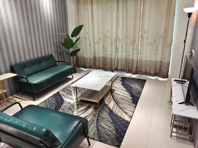 a living room with a couch and a table at Pavilionvillie M1T11 by irainbow in Simpang Pulai
