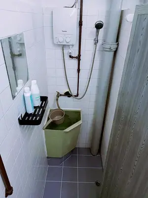 a bathroom with a green tub and a sink at Jo-Rumah 3 Bedroom Apartment Jelutong Georgetown Penang Free WIFI in Jelutong