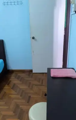 a bathroom with a toilet and a pink towel at Rent Room in Ipoh