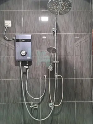 a shower with a shower head in a bathroom at HOMESTAY EPOH MANJOI WITH PRIVATE POOL AND JACUZZI in Ipoh