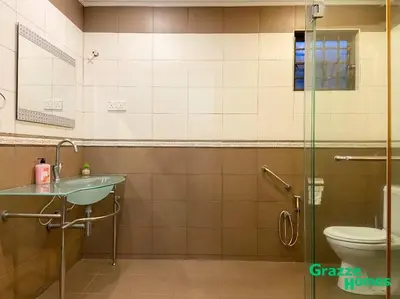 a bathroom with a shower and a sink and a toilet at Ipoh Town Bangalow Canning Garden Football Table in Ipoh