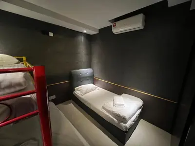 a small room with two bunk beds in it at MARITIME SUITES DUPLEX MARVELOUS SEA VIEW in George Town