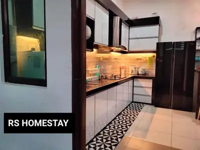 a kitchen with black and white tile on the floor at RS Homestay in Sungai Petani