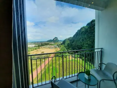 a room with a balcony with a view at Onsen Suite at Sunway Lost World Tambun in Ipoh