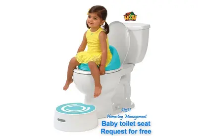 a little girl sitting on a baby toilet seat at H2H - CosyStay @ Majestic Ipoh Town Central in Ipoh
