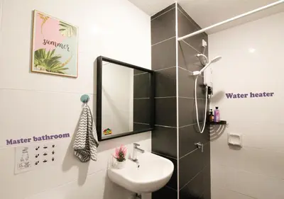 a bathroom with a sink and a mirror at H2H - CosyStay @ Majestic Ipoh Town Central in Ipoh