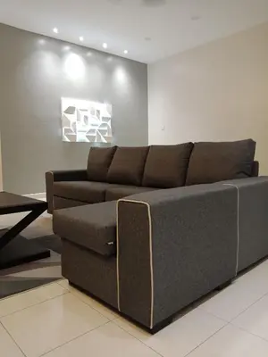 a living room with a couch and a table at 61 Homestay in Sitiawan