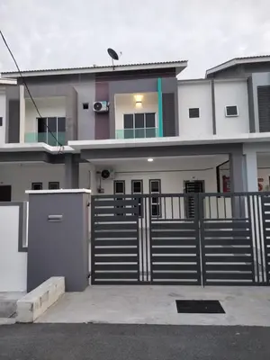 a house with a gate in front of it at 61 Homestay in Sitiawan