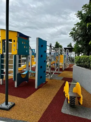 a playground with a yellow and blue play equipment at Ipoh Peaceful Onsen studio Lost World Tambun in Tambun