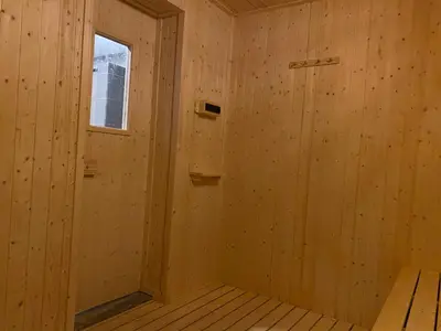 a sauna with wooden walls and a window at Sunway City Onsen COSY HOME Tambun Ipoh in Ipoh