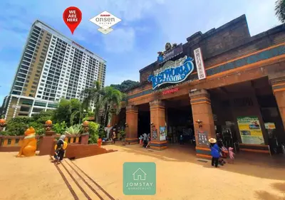 a building with a sign on the front of it at JOMSTAY Sunway Onsen Suites Ipoh - Lost World of Tambun Ipoh Waterpark in Tambun
