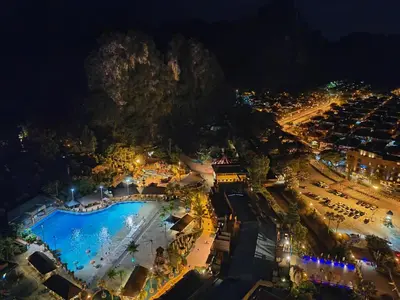 an aerial view of a swimming pool at night at Cozy Suite with 270 Degree Mountain and Theme Park Views in Ipoh