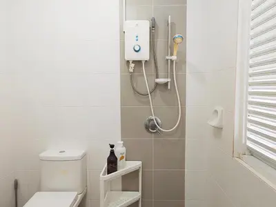 a bathroom with a shower and a toilet at Ocean 27 Batu Ferringhi Shamrock Beach 6 Bedroom 22pax with Pool in Batu Ferringhi