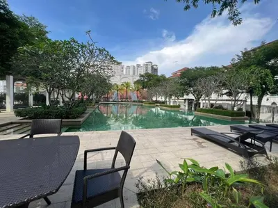 a swimming pool with chairs and tables in a building at Lucky Waterfront at Straits Quay Seaview or Non in Bagan Jermal