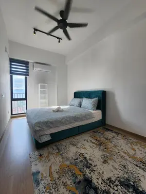 a bedroom with a bed and a ceiling fan at Praicon Tower - Premium Suite in Butterworth