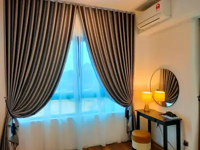 a room with a large window with curtains at Studio in Sunway Onsen @ Lost World of Tambun for 4 in Ipoh