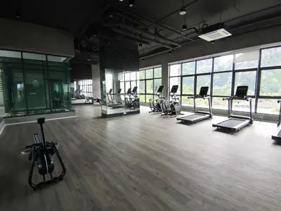 a gym with a bunch of exercise equipment in a room at Studio in Sunway Onsen @ Lost World of Tambun for 4 in Ipoh