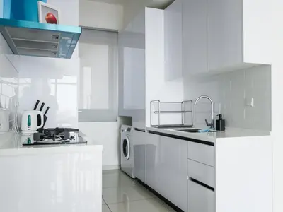 a white kitchen with a sink and a dishwasher at Beacon Executive Suites by S&F #InfinityPool #SkyGym in George Town