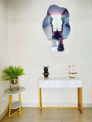 a room with a white table and a table with arax at \u300aUntitled HomeStay\u300bSitiawan in Sitiawan