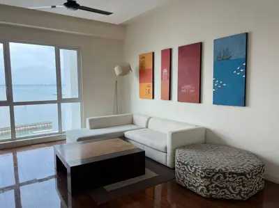 a living room with a couch and a coffee table at Perfect Marina Stay@ Strait Quay /w Big Balcony + Carpark in Bagan Jermal