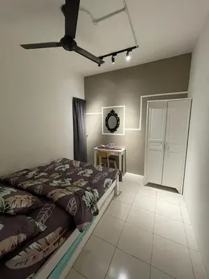 a bedroom with a bed and a ceiling fan at Cameron Sweet Muslim Apartment 2 - Iiqoma Muslim Homestay in Tanah Rata