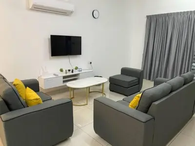 a living room with two couches and a tv at KY Happiness Homestay Tanjong Karang \u5feb\u4e50\u6c11\u5bbf in Tanjung Karang