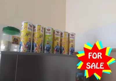 a shelf with toys and a for sale sign on it at Homestay Cikgu Muaz in Kuala Kangsar