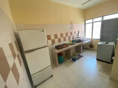 a kitchen with a white refrigerator and a sink at Homestay Cikgu Muaz in Kuala Kangsar