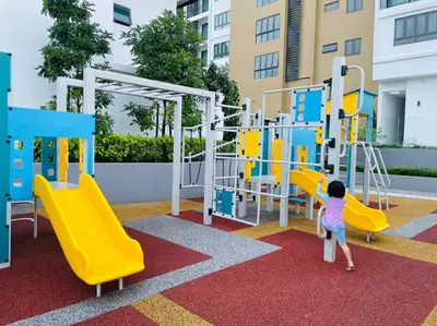 a young child playing on a playground at Sunway Onsen Suite Tambun Ipoh Mountain View in Ipoh