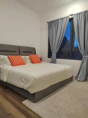 a bedroom with a large bed and a window at Sunway Onsen Suite Tambun Ipoh Mountain View in Ipoh