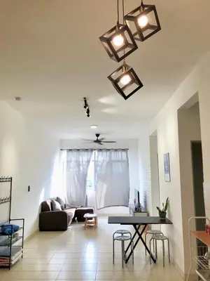 a living room with a couch and a table at ECO Apartment (Ipoh Falim) -2B2B in Ipoh