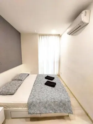 a bedroom with two beds and a window at SG10-4Pax 2rooms Studio Georgetown in George Town