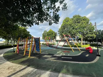a playground with a slide in a park at Spacious Family Staycation 3BR at Ipoh Uptown in Ipoh